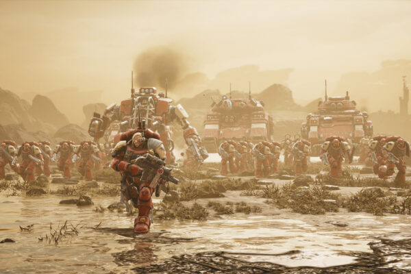 Un marine espacial avanza frente a vehículos y tropas de Dawn of War IV