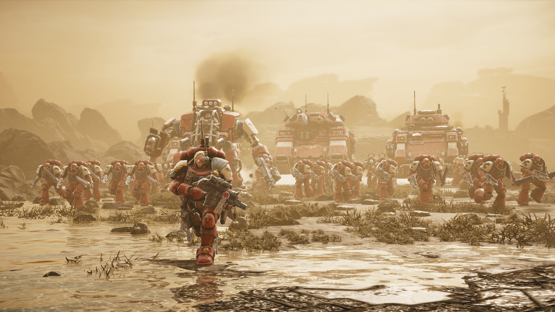 Un marine espacial avanza frente a vehículos y tropas de Dawn of War IV