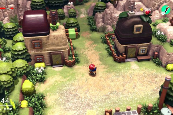Un pequeño personaje recorre un pueblo de casas de piedra y árboles en Littlelands